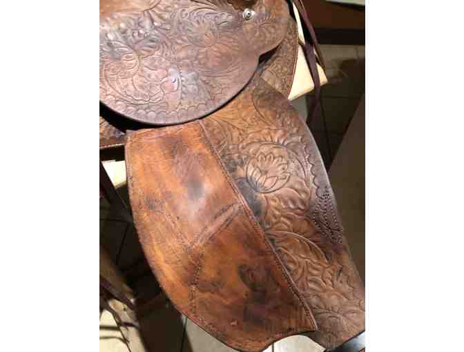 Vintage Western saddle with handcrafted tooled leather
